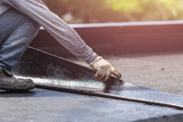 Professional Basement Waterproofing technician working in Slayden, TN